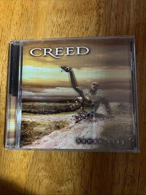 Creed Human Clay CD Cover Art — Brown, Gold & Tan Tones